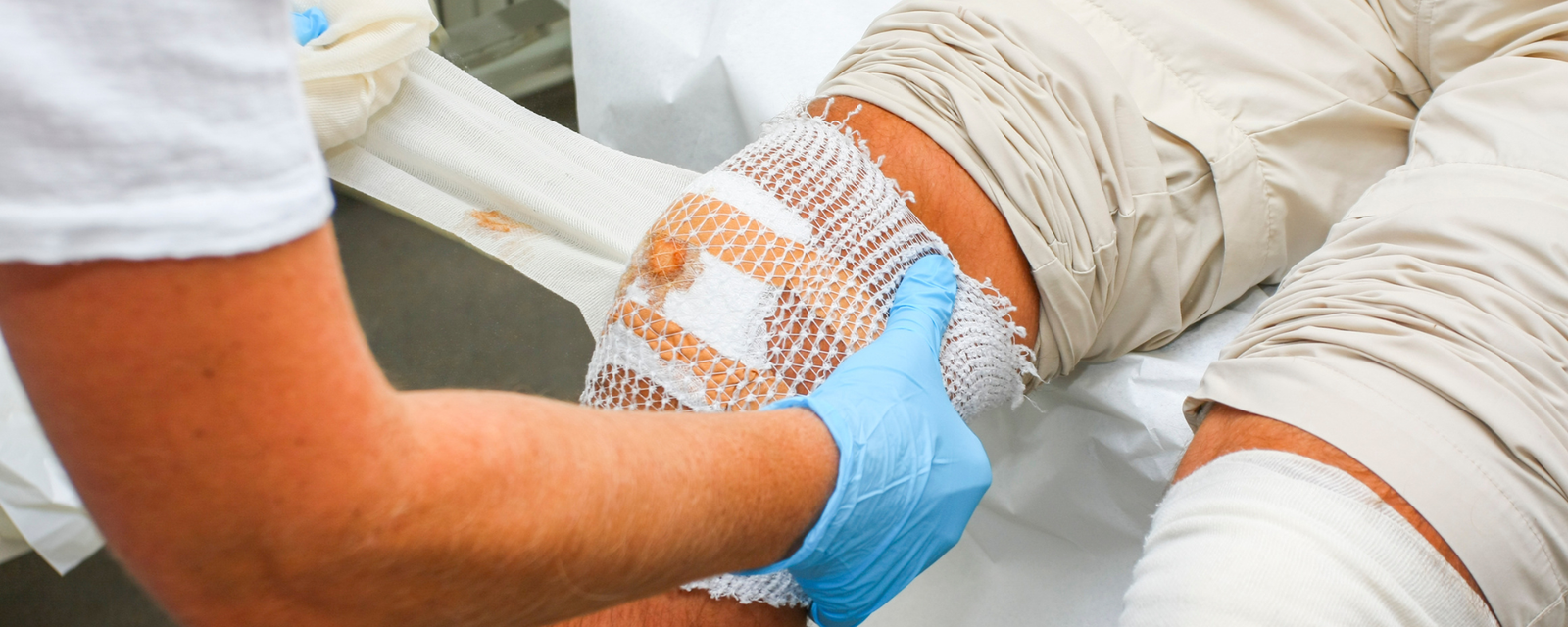 Nurse applying wound care dressing